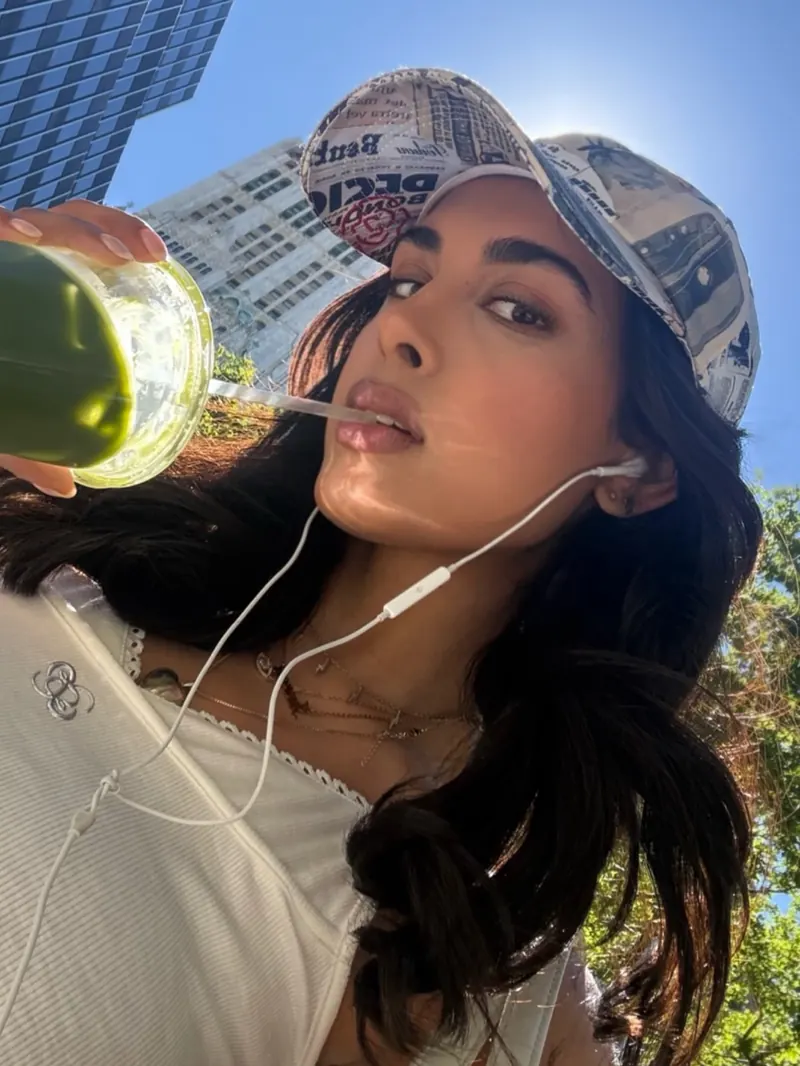 A woman drinking from a No Plates can